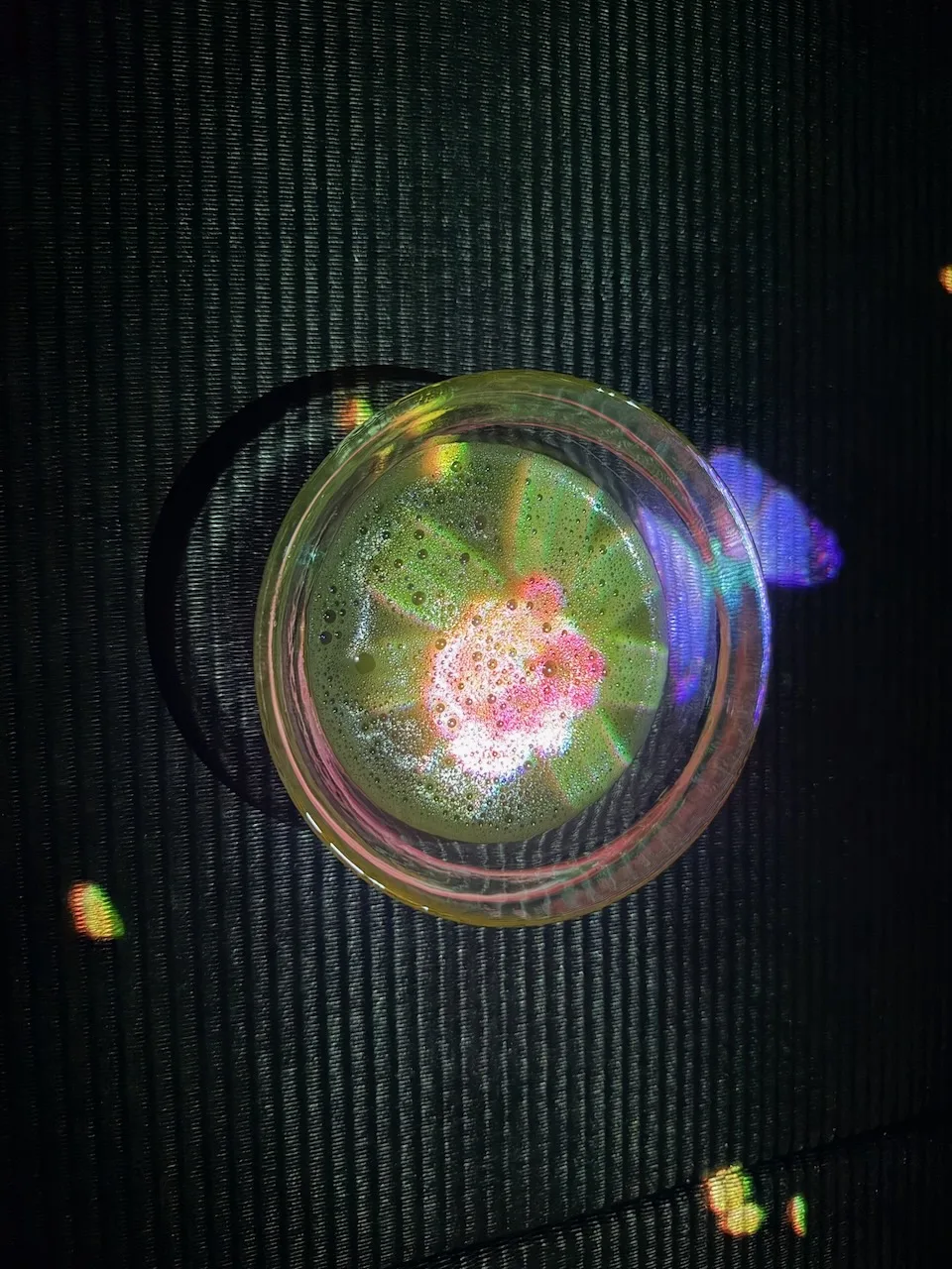 Glowing cup of tea with a light flower inside at EN Tea House, teamLab Borderless
