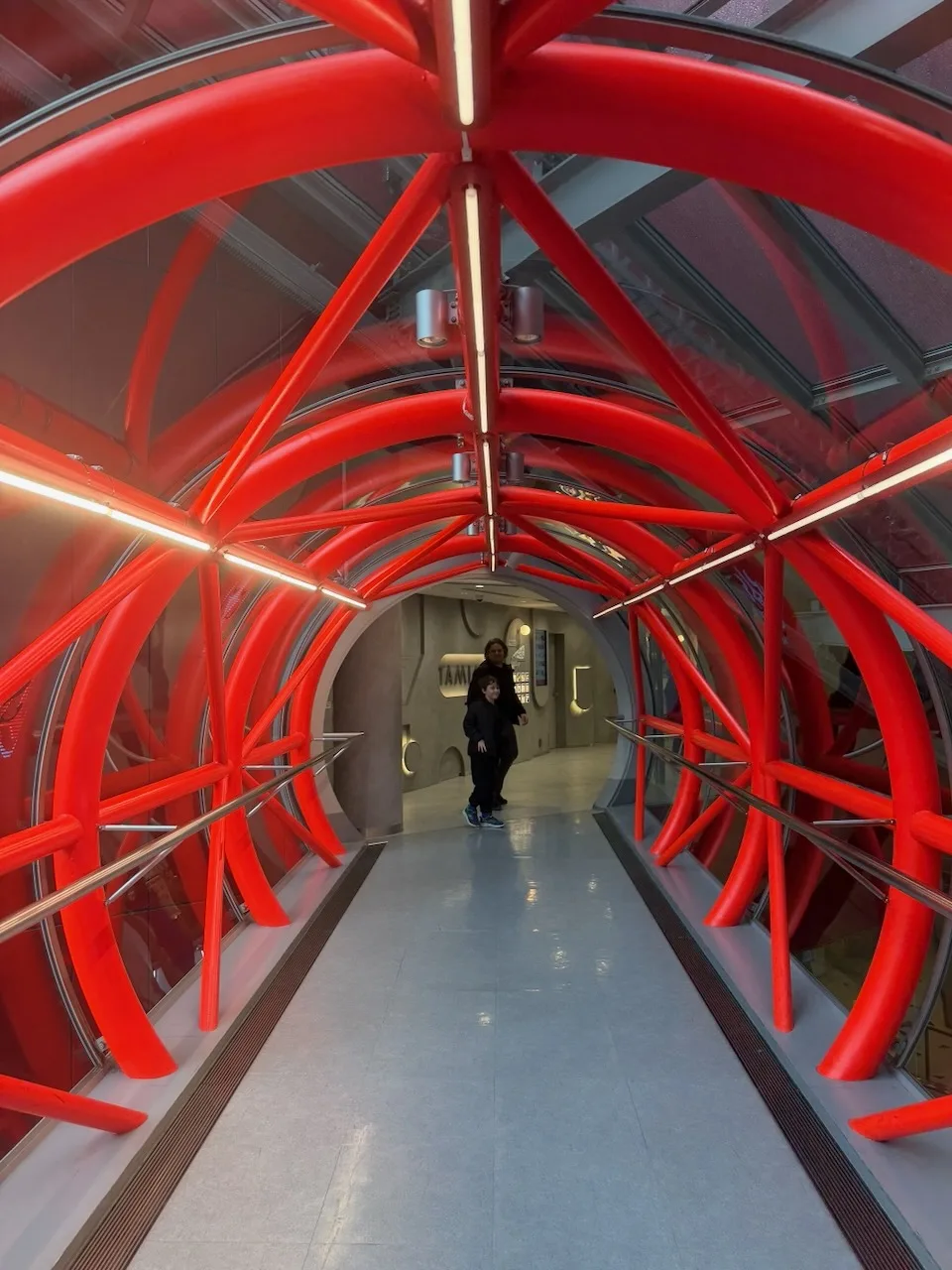 Red steel tube walkway connecting buildings in Umeda, Osaka